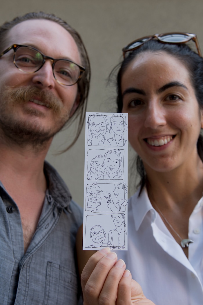 (Leah Hogsten | The Salt Lake Tribune) Charlie Zuckerman and girlfriend Nichole Anderson show off their caricature drawn by artist Natalie Allsup-Edwards at the 9th Annual Craft Lake City DIY Festival, Friday, August 11, 2017. The festival runs through Sunday, August 13th at the Gallivan Center.
