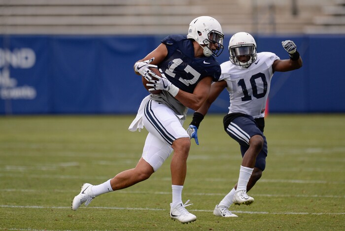 (Francisco Kjolseth  |  The Salt Lake Tribune)  Moroni Laulu-Pututau gets chased down by Kamel Greene as BYU holds a scrimmage at LaVell Edwards Stadium in Provo on Thursday, Aug. 10, 2017.