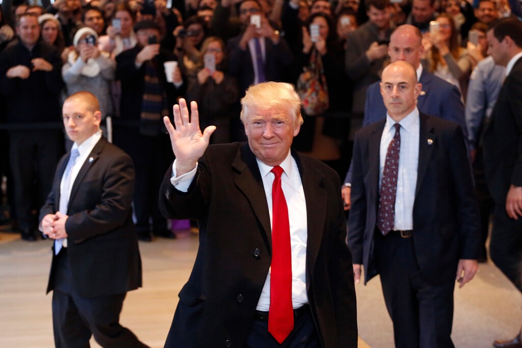 (Mark Lennihan | The Associated Press) President-elect Donald Trump waves to the crowd as he leaves the New York Times building following a meeting, Tuesday, Nov. 22, 2016, in New York.