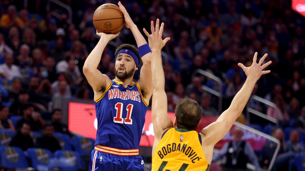 Golden State Warriors guard Klay Thompson (11) shoots against Utah Jazz forward Bojan Bogdanovic (44) during the first half of an NBA basketball game in San Francisco, Saturday, April 2, 2022. (AP Photo/Jed Jacobsohn)