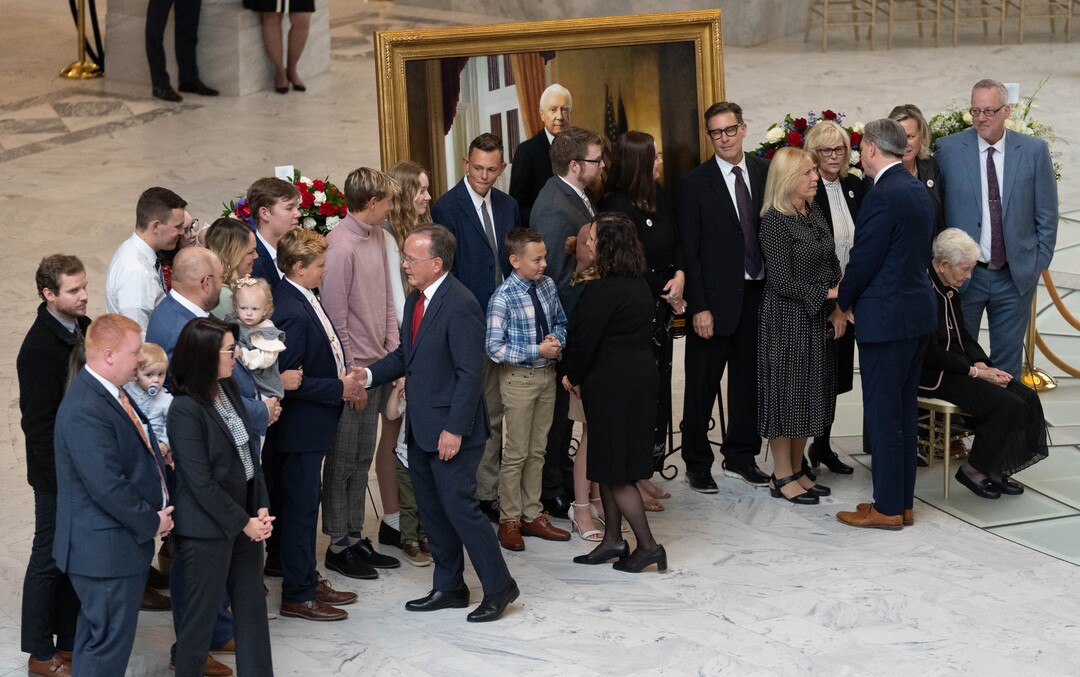 (Francisco Kjolseth | The Salt Lake Tribune) Lt. Gov. Deidre Henderson, Utah Senate President Stuart Adams and state treasurer Marlo Oaks greet the family after placing a wreath alongside the casket carrying former U.S. Sen. Orrin Hatch during a public viewing at the Utah Capitol on Wednesday, May 4, 2022.