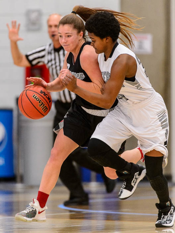 (Trent Nelson | The Salt Lake Tribune)  American Fork's Jamie Shepherd (22) defended by Riverton's Makenzie McCombs (35) as Riverton faces American Fork in the 6A High School Girls' Basketball Tournament at SLCC in Taylorsville, Tuesday Feb. 20, 2018.
