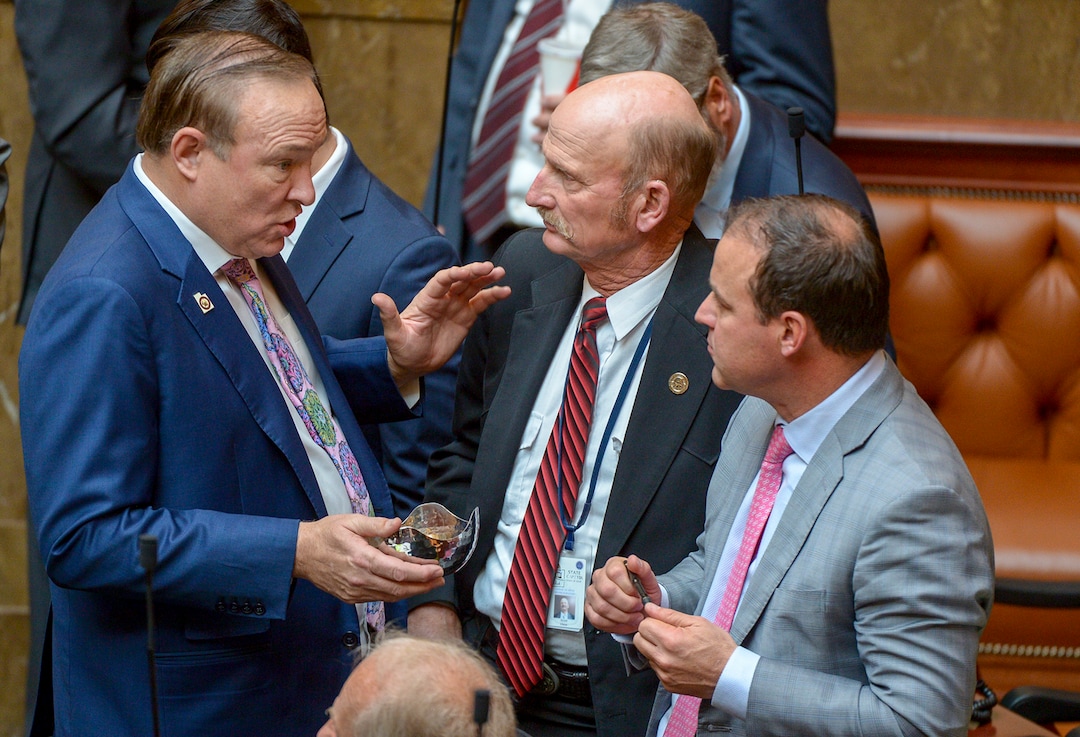(Leah Hogsten  |  The Salt Lake Tribune)  l-r Outgoing State Sen. Jim Dabakis talks with Rep. Scott Chew, R-Jensen and Rep. Mike Schultz, R-Hooper about the Utah Medical Cannibis Act. Debakis jokingly offered Utah House members candy gummy bears that look similar to marijuana-infused edibles. Utah legislators voted to change the Utah Medical Cannabis Act, the bill that officials, Prop 2 opponents and medical marijuana advocates crafted and pitched as a compromise. On Monday, Dec. 2, 2018 during the special session, lawmakers overhauled the medical cannabis distribution system, reduces the number of medical marijuana outlets, prohibits edibles for gelatin cubes instead and changes the list of illnesses that qualify for cannabis treatments.