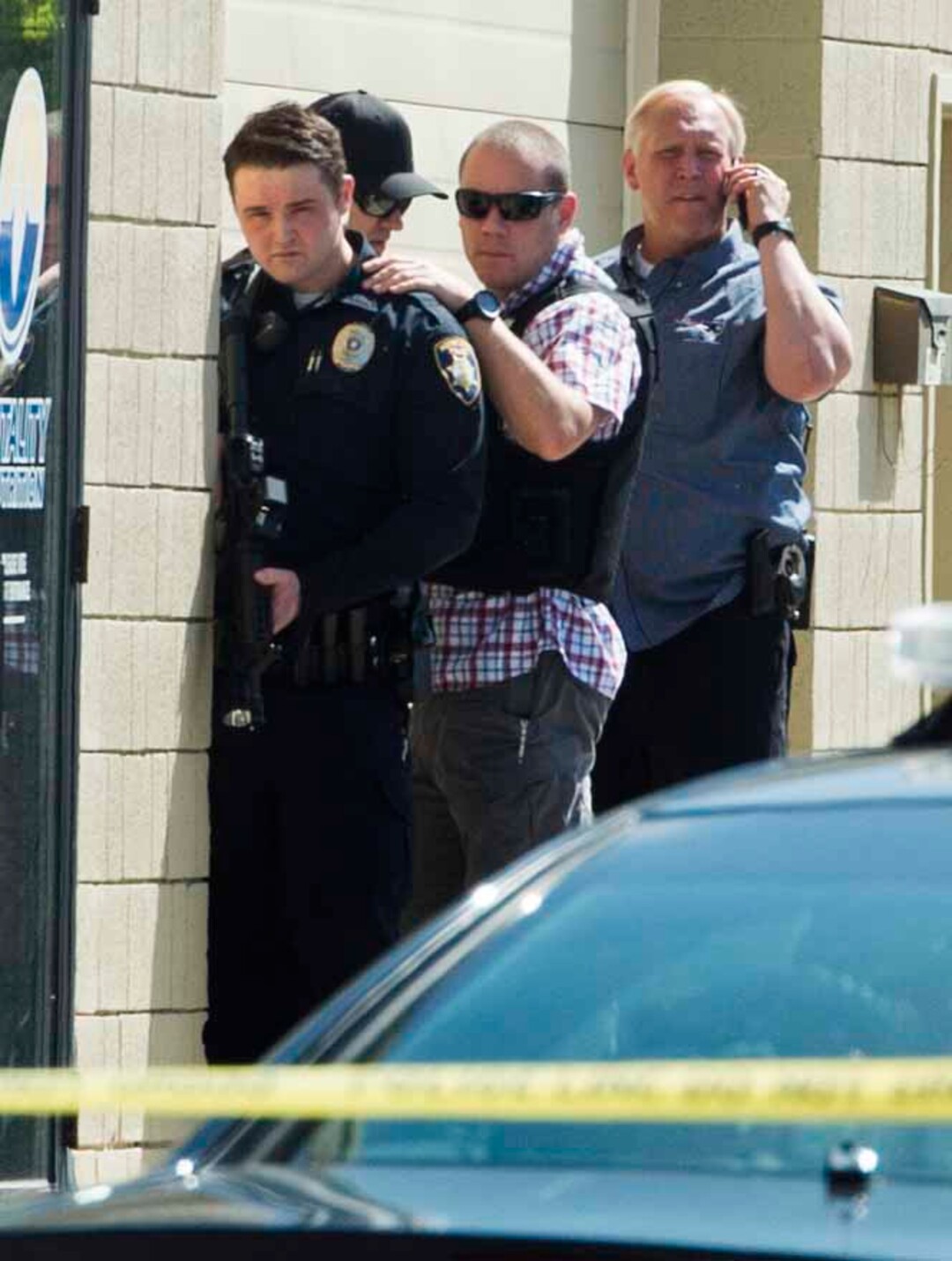 (Rick Egan | The Salt Lake Tribune) Bountiful police investigate after they say a store clerk shot an armed robbery suspect at Bountiful Pawn and Sales on Thursday, May 3, 2018. Police are looking for a second suspect in the attempted armed robbery.