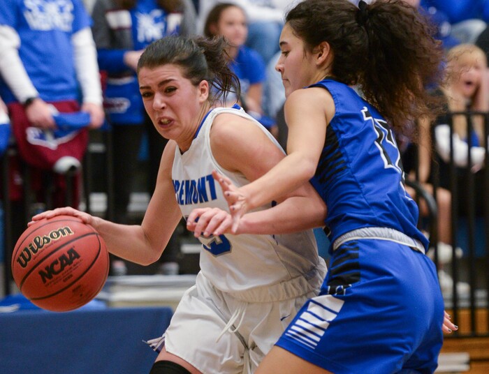 (Leah Hogsten  |  The Salt Lake Tribune) Bingham's Ameleya Angilau (12) pressures Fremont's Mazzie Melaney (15) as she drives to the net. Fremont defeated Bingham 61-47 to win the 6A High School Girls' Basketball Tournament title at SLCC in Taylorsville,Saturday, Feb. 24, 2018. 