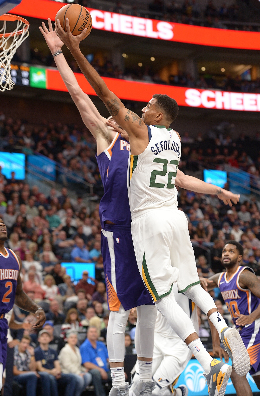 (Leah Hogsten  |  The Salt Lake Tribune) Utah Jazz forward Thabo Sefolosha (22) rounds Phoenix Suns center Alex Len (21) on his way to the net.  The Utah Jazz defeated the Phoenix Suns 112-101 during preseason NBA basketball at Vivint Smart Home Arena in Salt Lake City, October 6, 2017.