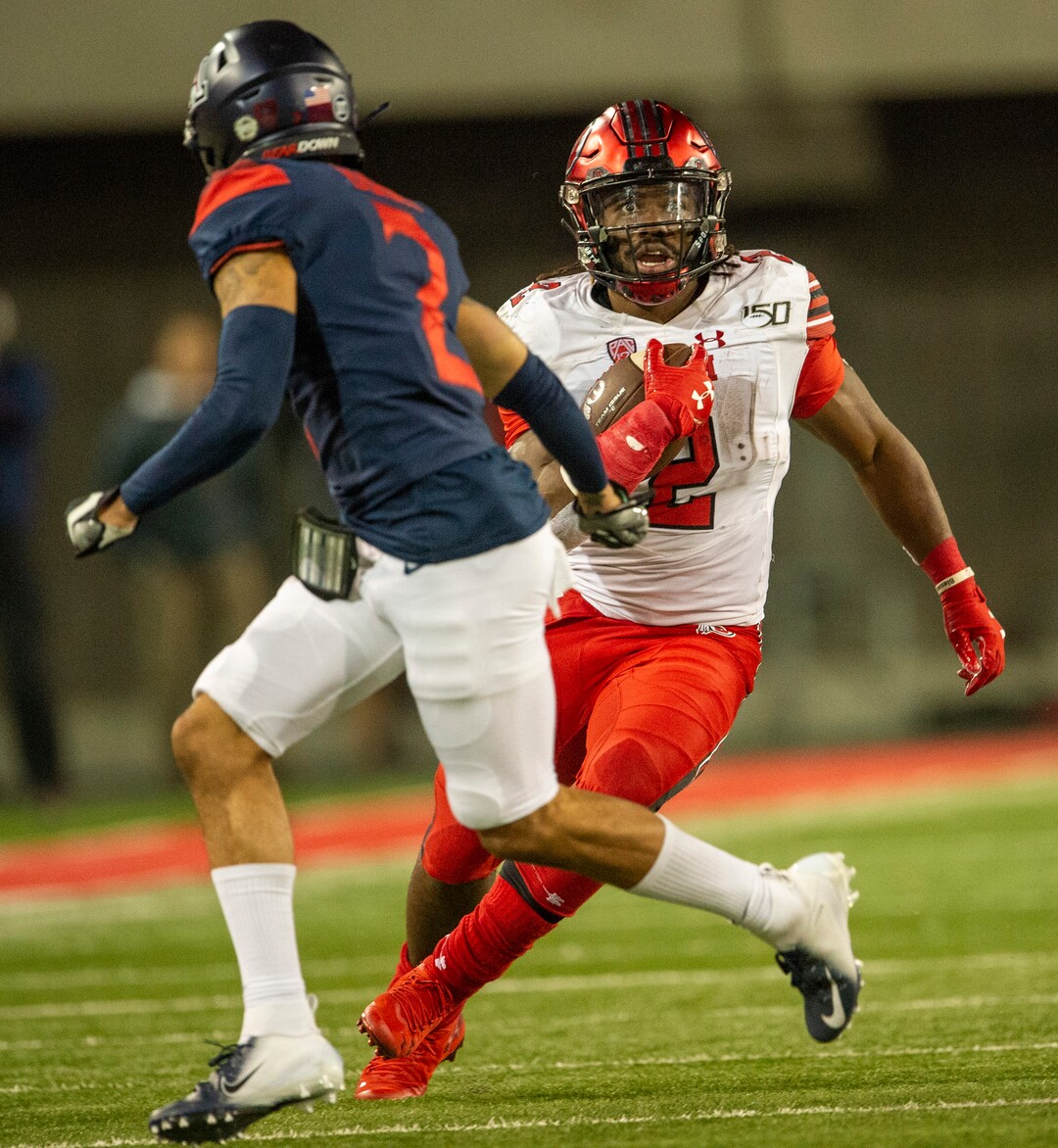 (Rick Egan  |  The Salt Lake Tribune)      Utah Utes running back Zack Moss (2) runs the ball as Arizona Wildcats cornerback Lorenzo Burns (2) defends, in PAC-12 action between the Utah Utes and the Arizona Wildcats in Tucson, Saturday, Nov. 23, 2019.