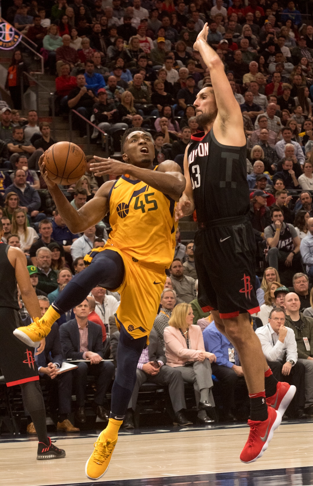 (Rick Egan  |  The Salt Lake Tribune)  Utah Jazz guard Donovan Mitchell (45) takes the ball inside as Houston Rockets forward Ryan Anderson (33) in NBA action, Utah Jazz vs Houston Rockets in Salt Lake City, Thursday, December 7, 2017.