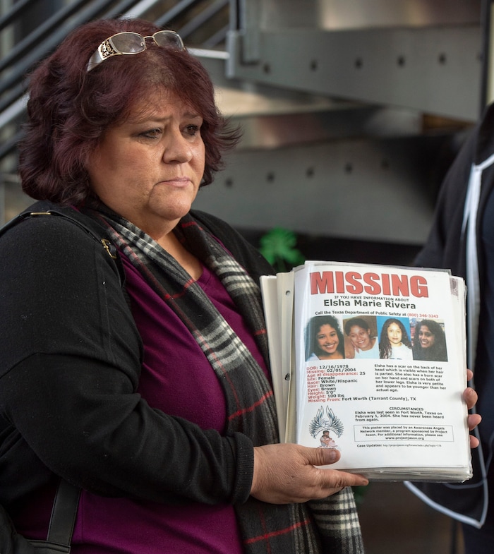 (Rick Egan  |  The Salt Lake Tribune)   Elizabeth Rivera holds a poster with photos of her daughter Elsha, who went missing in 2004, at the inaugural Missing In Utah event in Sandy. The Salt Lake City Police Department, and nonprofit organizations invited people to come talk with them about opening a new, or adding to an existing, missing person case. Saturday, March 9, 2019.


