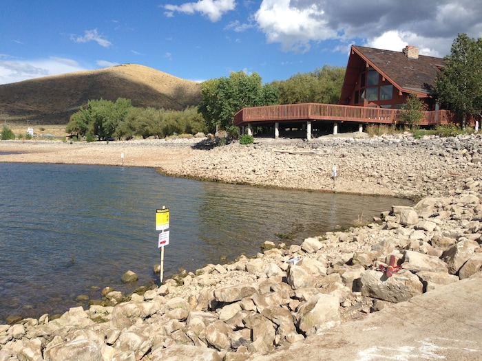 (Courtesy Wasatch County Health Department) The Wasatch County Health Department posted signs near the Dock of the Bay restaurant and boat dock at Deer Creek Island Resort on Tuesday after initial tests indicated high levels of toxins produced by certain kinds of algae were present. This particular bloom of toxic algae remains an extremely localized event, officials say, but several blooms have cropped up around the state in recent weeks.