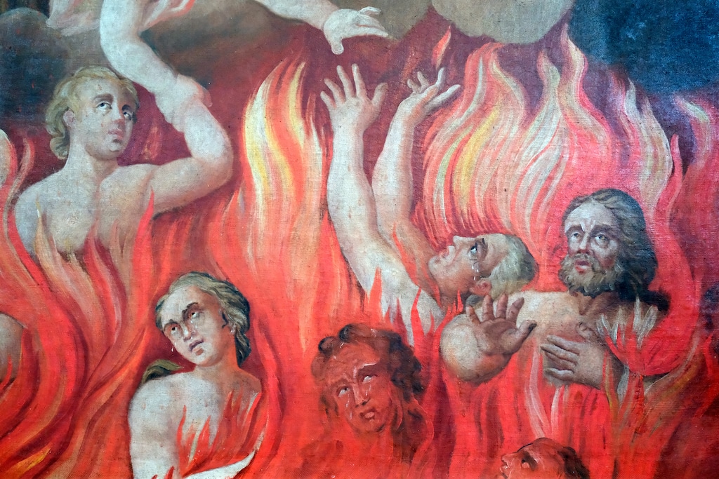 (Pascal Deloche | Godong Photo via Adobe Stock) A baroque painting depicting tortured souls engulfed in flames at St. Nicolas de Veroce church in Saint-Gervais-les-Bains, France. Latter-day Saint Steven L. Peck offers a different take on the fate of damned souls in his horror novella, "A Short Stay in Hell."