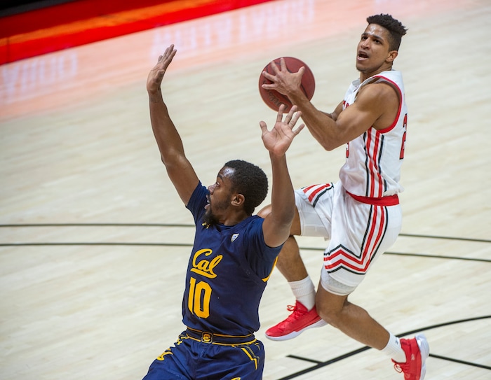(Rick Egan | The Salt Lake Tribune) California Golden Bears guard Makale Foreman (10) defends as Utah Utes guard Alfonso Plummer (25) scores on a fast break the the end of the first half, in PAC12 Basketball action between the Utah Utes and the California Golden Bears, on Wednesday, Jan. 16, 2021.