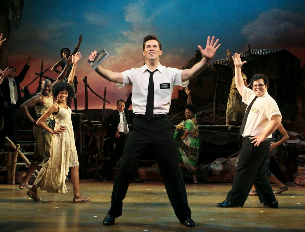 (Sara Krulwich | The New York Times) Rema Webb, left, Andrew Rannells and Josh Gad in "The Book of Mormon" musical at the Eugene O'Neill Theater in New York in 2011. They are scheduled to return for 15th anniversary appearance next month, but a theater fire has closed the Broadway show temporarily.