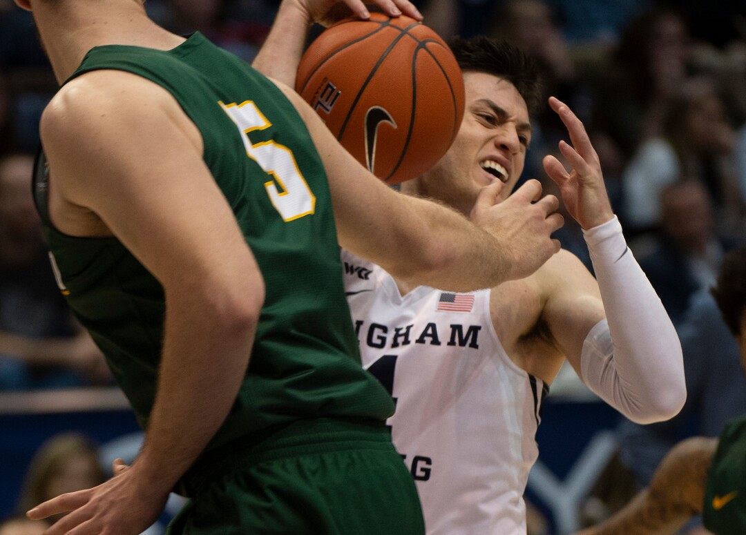 (Rick Egan  |  The Salt Lake Tribune)    Brigham Young Cougars guard Alex Barcello (4) grabs a rebound as San Francisco Dons center Jimbo Lull (5) defends, in WCC basketball acton between the Brigham Young Cougars and the San Francisco Dons, at the Marriott Center, Saturday, Feb. 8, 2020.