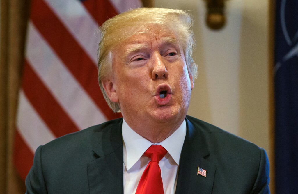 FILE - In this Thursday, May 17, 2018, file photo, U.S. President Donald Trump speaks during a meeting in the Cabinet Room of the White House, in Washington. Trump said he will "demand" that the Justice Department open an investigation into whether the FBI infiltrated his presidential campaign, an extraordinary order that came hours before his legal team said the special counsel indicated its investigation into the president could be concluded by September. (AP Photo/Carolyn Kaster, File)