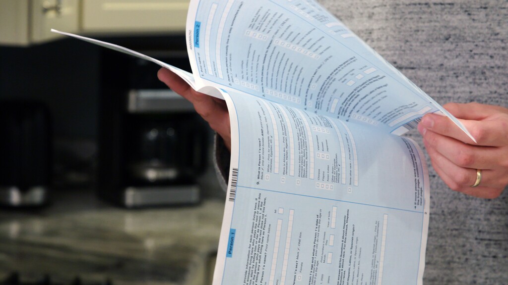 (Courtesy of the U.S. Census Bureau) A paper questionnaire is reviewed.