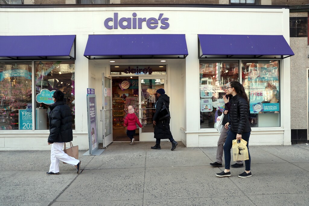 (Michelle V. Agins | The New York Times) A woman and child enter a Claire's store in New York on Monday, March 19, 2018.