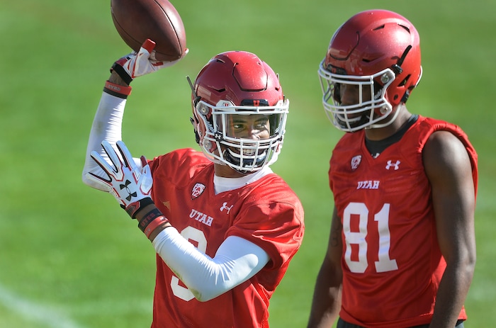 Scott Sommerdorf | The Salt Lake Tribune
New Utah WR Darren Carrington II smiles as he works on a catching drill during the first day of Utah fall football camp, Friday, July 28, 2017.