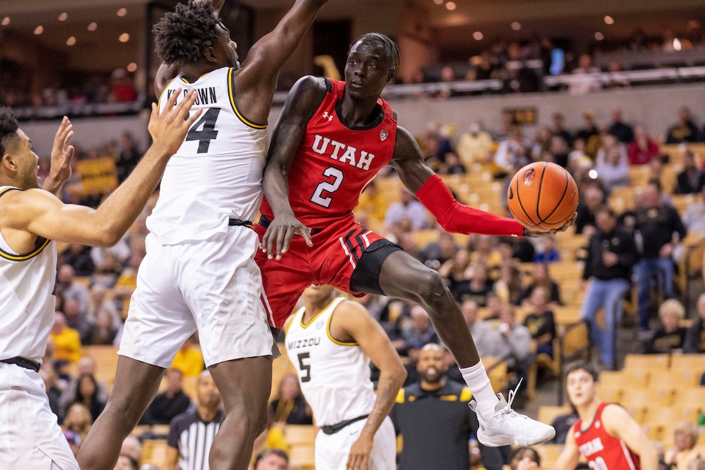 Utah's Both Gach, right, passes around Missouri's Kobe Brown, left, during the first half of an NCAA college basketball game Saturday, Dec. 18, 2021, in Columbia, Mo. (AP Photo/L.G. Patterson)