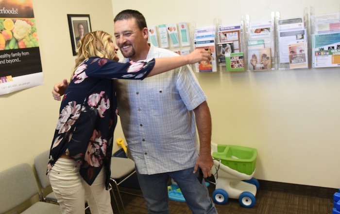(Francisco Kjolseth | The Salt Lake Tribune) Savannah Eley gets a visit from detective John Barnett, one of two officers who she said turned her life around. Now two and a half years clean, Eley is helping others recover from addiction at the Southeast Utah Health Department in Price.