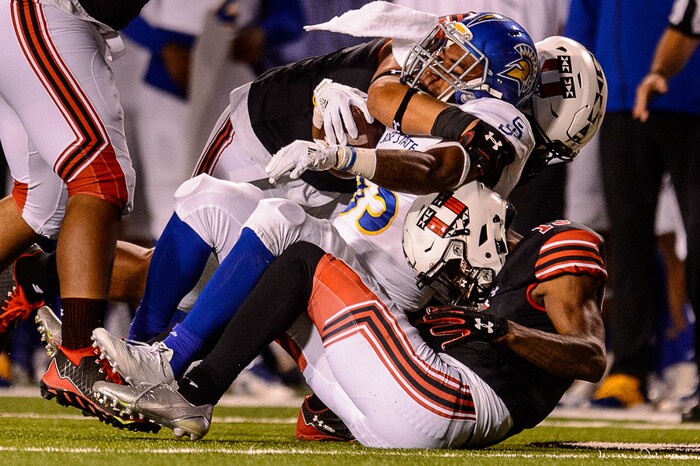 (Trent Nelson | The Salt Lake Tribune) Utah Utes defensive tackle Pita Tonga (49) brings down San Jose State Spartans running back DeJon Packer (35) as the Utah Utes host the San Jose State Spartans, NCAA football at Rice-Eccles Stadium in Salt Lake City, Saturday September 16, 2017.
