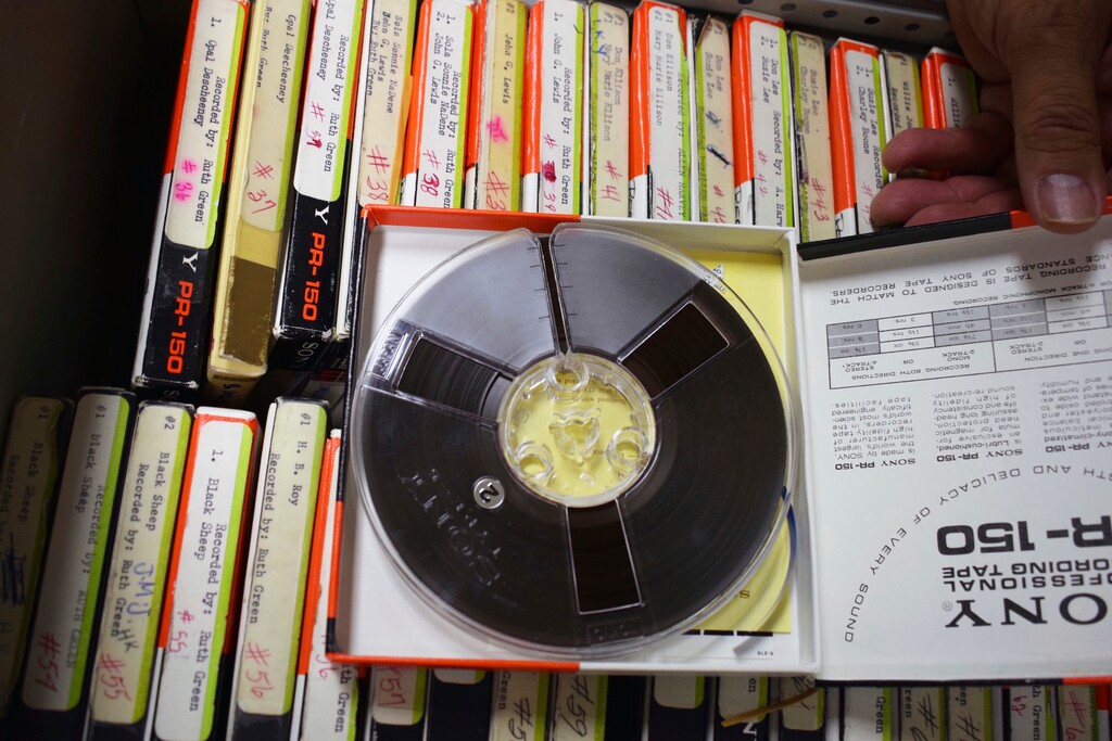 (Vida Volkert | Gallup Independent | The Associated Press) In this Thursday, June 14, 2018, photo, this tape is part of a special collection of more than 1,700 reel-to-reel magnetic tapes, containing interviews with Navajo elders and medicine people conducted in the 1960s-1970s, that are currently stored in the library inside the Navajo Nation Museum in Window Rock, Ariz.