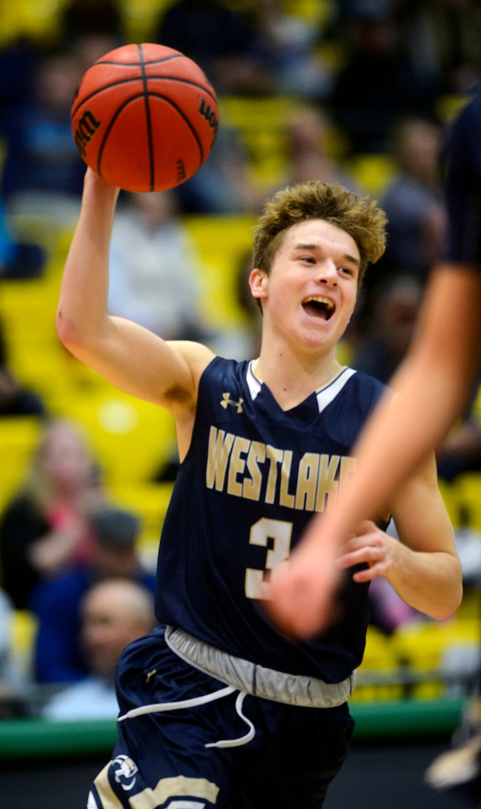 (Steve Griffin | The Salt Lake Tribune) Westlake's Austin White smiles as he dribbles out the clock as Westlake defeated Riverton in 6A basketball playoff game at the Utah Valley University’s UCCU Center in Provo Tuesday Feb. 27, 2018.