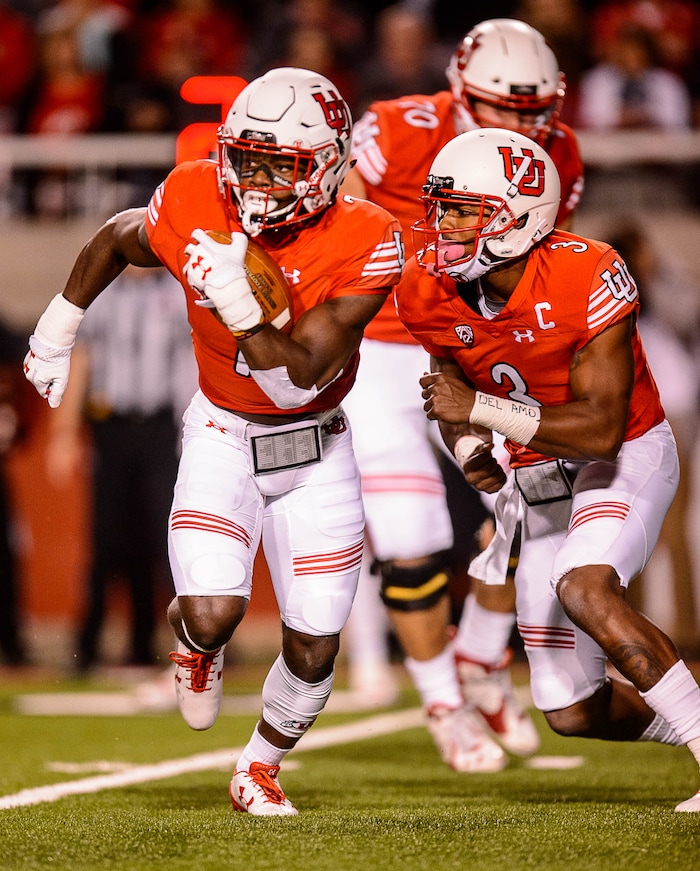 (Trent Nelson | The Salt Lake Tribune)  Utah Utes quarterback Troy Williams (3) hands off to Utah Utes running back Zack Moss (2) as the University of Utah hosts Stanford, NCAA football at Rice-Eccles Stadium in Salt Lake City Saturday October 7, 2017.
