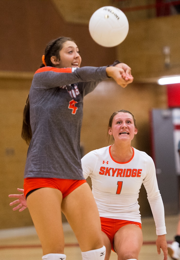 (Rick Egan  |  The Salt Lake Tribune)   Cierra (Cici) Hauver hits the ball for Skyridge, as Reagen Calton (1) looks on, in volleyball action, Bountiful vs. Skyridge, at Bountiful High, Wednesday, September 6, 2017.
