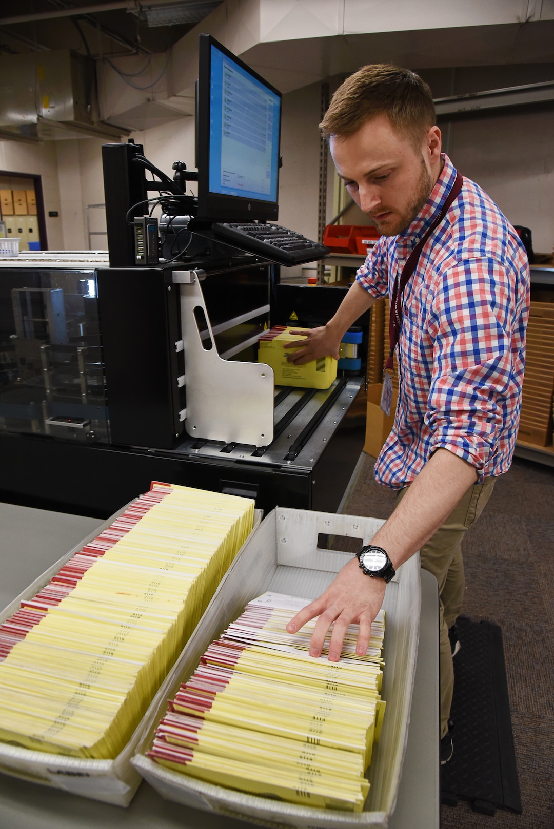 (Francisco Kjolseth  |  The Salt Lake Tribune)  Data analyst Stephen Moore, processes mailed in ballots through an Agilis ballot sorting machine that can process up to 19,000 ballots an hour, taking pictures of the signature on the exposed affidavit and reading the bar code that shows a voter has returned their ballot for immediate confirmation on Tuesday, Oct. 301, 2018. Turnout numbers from the State Elections Office showed 359,219 people out of 1,390,679 active Utah voters have already cast their ballots as of Tuesday morning. 
