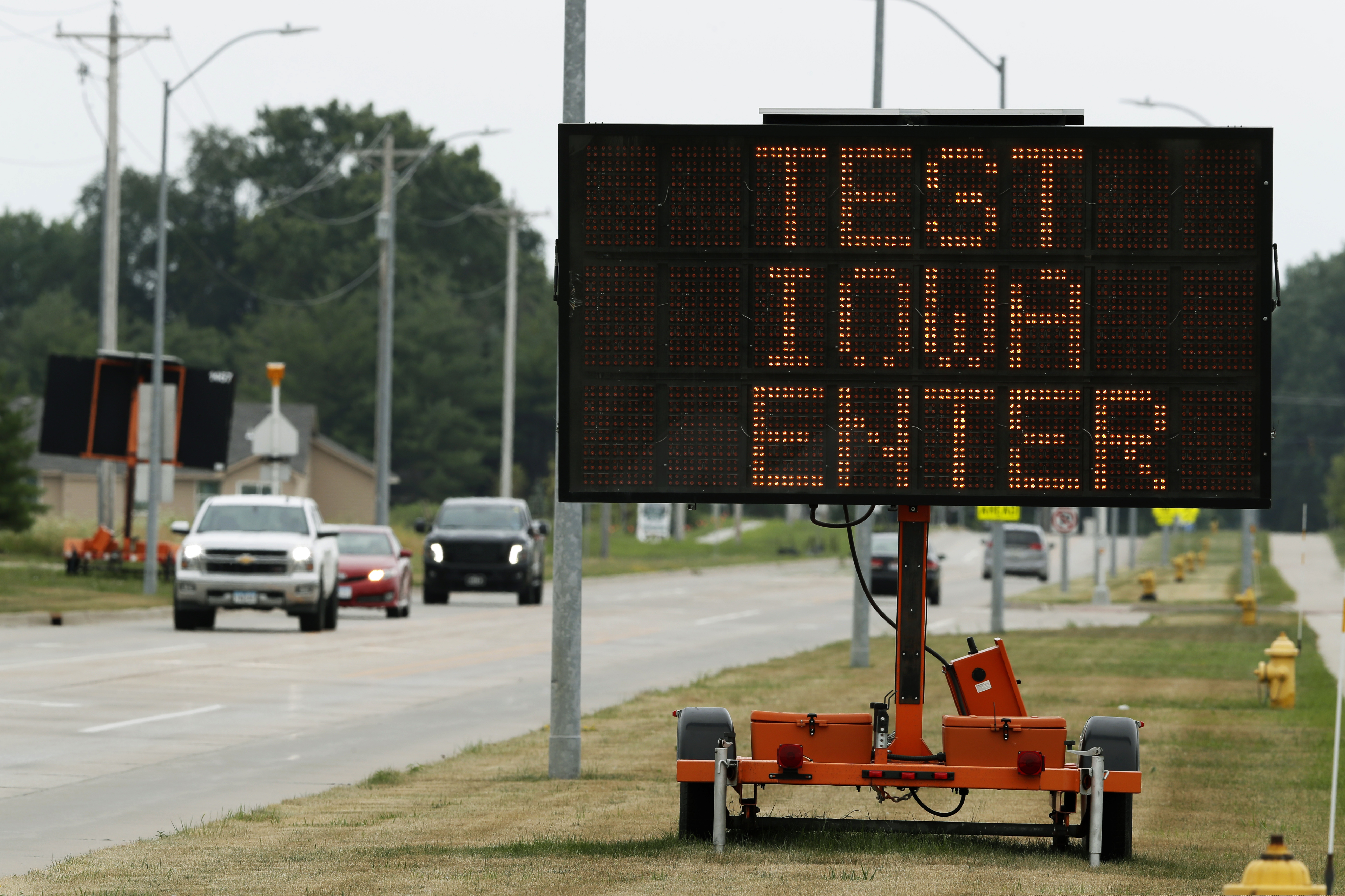 (Charlie Neibergall | The Associated Press )
A sign directs traffic to a Test Iowa COVID-19 testing site at Waukee South Middle School, Tuesday, in Waukee, Iowa. Iowa state Auditor Rob Sand said Tuesday that a coronavirus testing program brought to the state under a $28 million no-bid contract by Gov. Kim Reynolds on recommendation from actor Ashton Kutcher is violating state law in the indirect way it handles test results data.