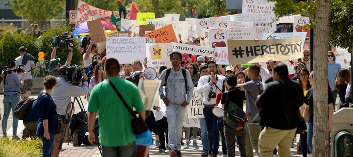 (Leah Hogsten  |  The Salt Lake Tribune) Hundreds of “We are Dreamers,” a Utah pro-Deferred Action for Childhood Arrival (DACA) group, marched in solidarity from the Utah Federal Building to the State Capitol with undocumented immigrants who will be affected by the end of DACA. 