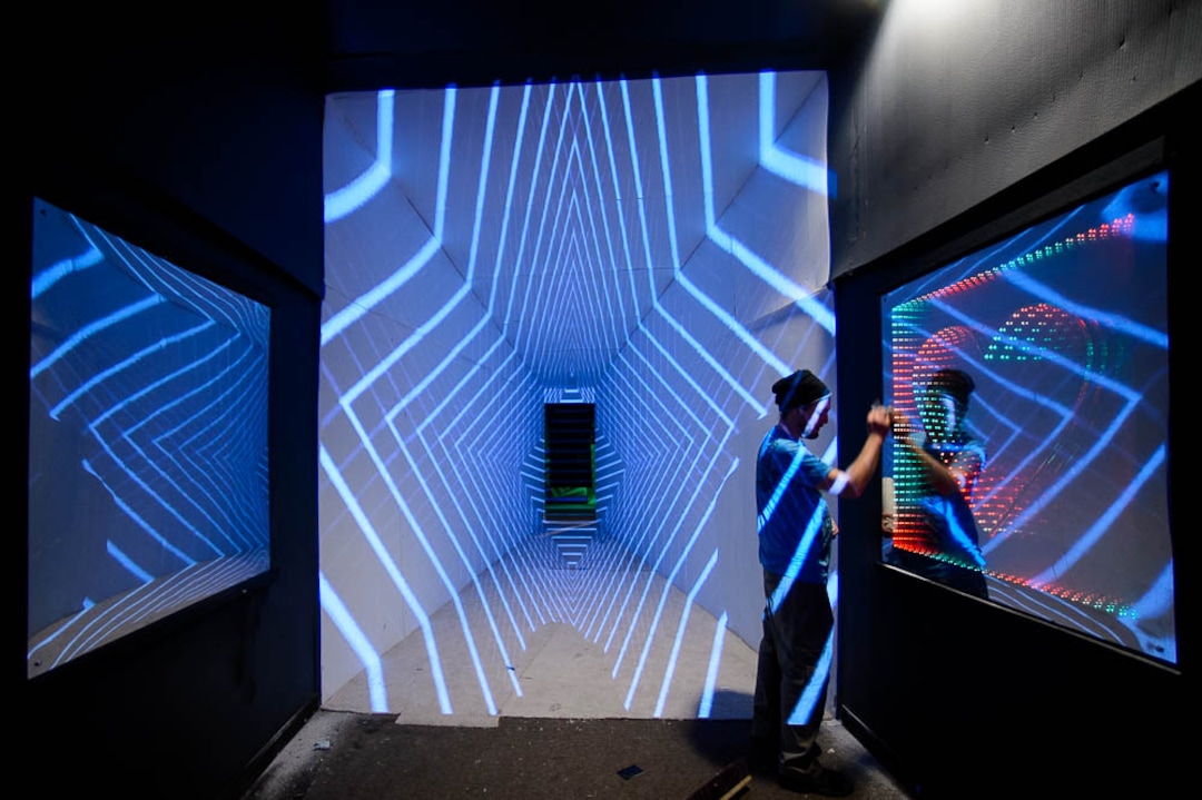 (Trent Nelson | The Salt Lake Tribune)  Alex Bartz working on the tapered hallway at dreamscapes in Salt Lake City on Tuesday March 12, 2019. Dreamscapes is a project of the Utah Arts Alliance. It runs for one month from March 15 through April 15. The art in the mirror was designed by Brandi Clayton.