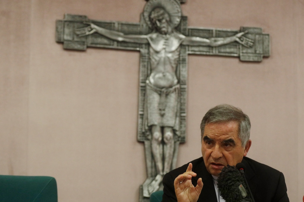 (Gregorio Borgia | AP) Cardinal Angelo Becciu talks to journalists during press conference in Rome, Friday, Sept. 25, 2020. The powerful head of the Vatican's saint-making office, Cardinal Angelo Becciu, has resigned from the post and renounced his rights as a cardinal amid a financial scandal that has reportedly implicated him indirectly.
