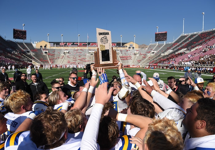 (Francisco Kjolseth  |  The Salt Lake Tribune)  Orem celebrates after winning the 4A high school championship game against Dixie at Rice-Eccles Stadium in Salt Lake City, Friday, Nov. 16, 2018. 