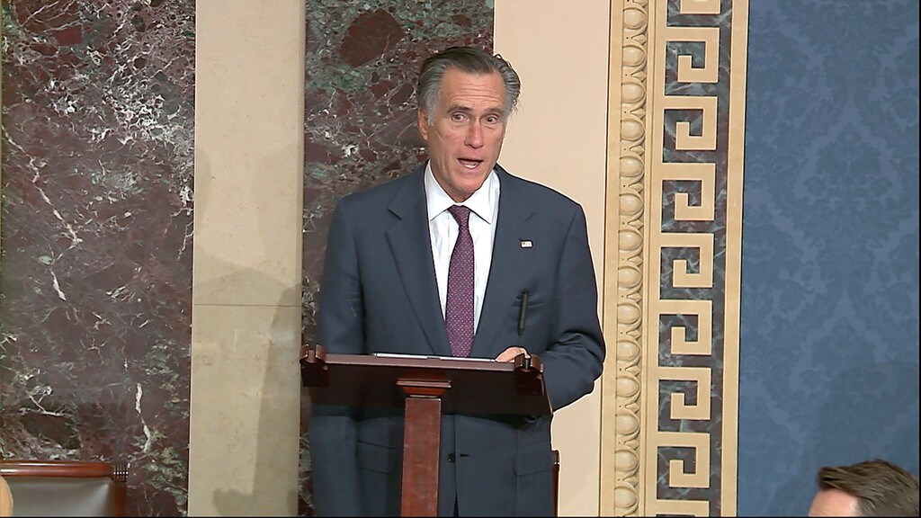 In this image from video, Sen. Mitt Romney, R-Utah, speaks as the Senate reconvenes to debate the objection to confirm the Electoral College Vote from Arizona, after protesters stormed into the U.S. Capitol on Wednesday, Jan. 6, 2021. (Senate Television via AP)