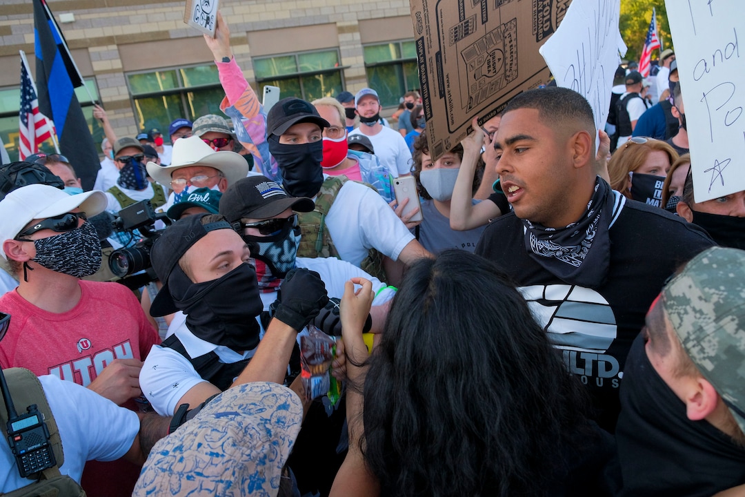 (Leah Hogsten  |  The Salt Lake Tribune) Supporters for Black Lives Matter exchange words with Blue Lives Matter supporters. Five days after after nine protesters were arrested during a peaceful rally in memory of Zane James that turned into a violent clash with Cottonwood Heights officers, demonstrators gathered outside the police station Friday to denounce CHPD's actions and its officers for inciting the violence.