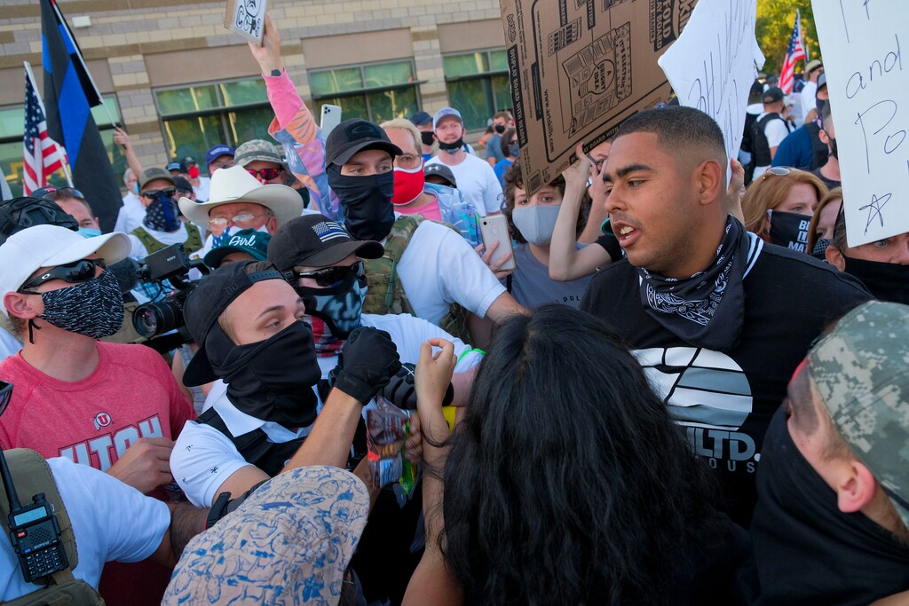 (Leah Hogsten | The Salt Lake Tribune) Supporters for Black Lives Matter exchange words with Utah Citizens' Alarm members and police supporters, including Landon Buttars, at an Aug. 7, 2020, protest in Cottonwood Heights. Buttars, 21, was charged Friday, Oct. 2, 2020, with assault for allegedly. pepper-spraying a citizen journalist later that evening.