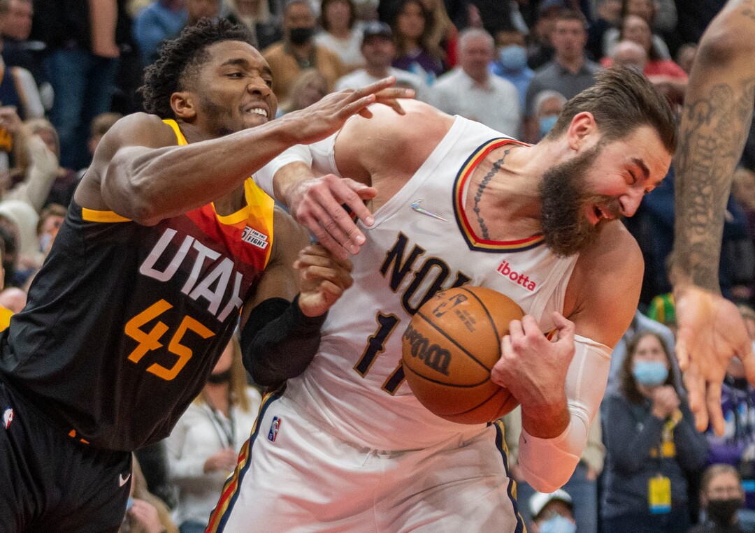 (Rick Egan | The Salt Lake Tribune) Utah Jazz guard Donovan Mitchell (45) battles New Orleans Pelicans center Jonas Valanciunas (17) for a rebound after missing his shot with just seconds left on the clock, in NBA action between the Utah Jazz and the New Orleans Pelicans, at Vivint Arena, in Salt Lake City, on Friday, Nov. 26, 2021.