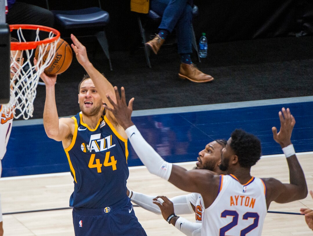 (Rick Egan | The Salt Lake Tribune) Utah Jazz forward Bojan Bogdanovic (44) shoots as Phoenix Suns center Deandre Ayton (22) defends, in NBA action between the Utah Jazz and the Phoenix Suns, on Thursday, Dec. 31, 2020.
