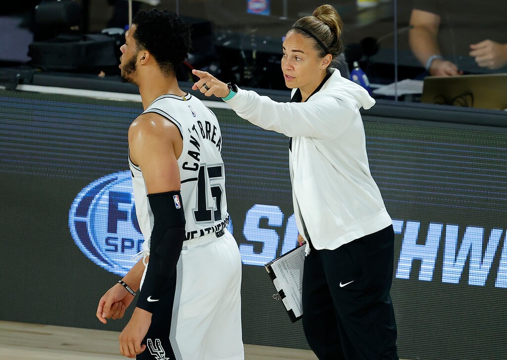 (Kevin C. Cox | Pool Photo via AP) San Antonio Spurs assistant coach Becky Hammon talks with Quinndary Weatherspoon (15) during the second half of an NBA basketball game against the Utah Jazz Friday, Aug. 7, 2020, in Lake Buena Vista, Fla.