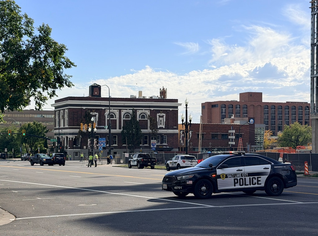 (Rachel Crosby | The Salt Lake Tribune) A Salt Lake City police patrol car blocks traffic on West Temple as investigators assess the scene of a fatal crash near the intersection of 400 South and West Temple in Salt Lake City on Monday, Oct. 5, 2026.