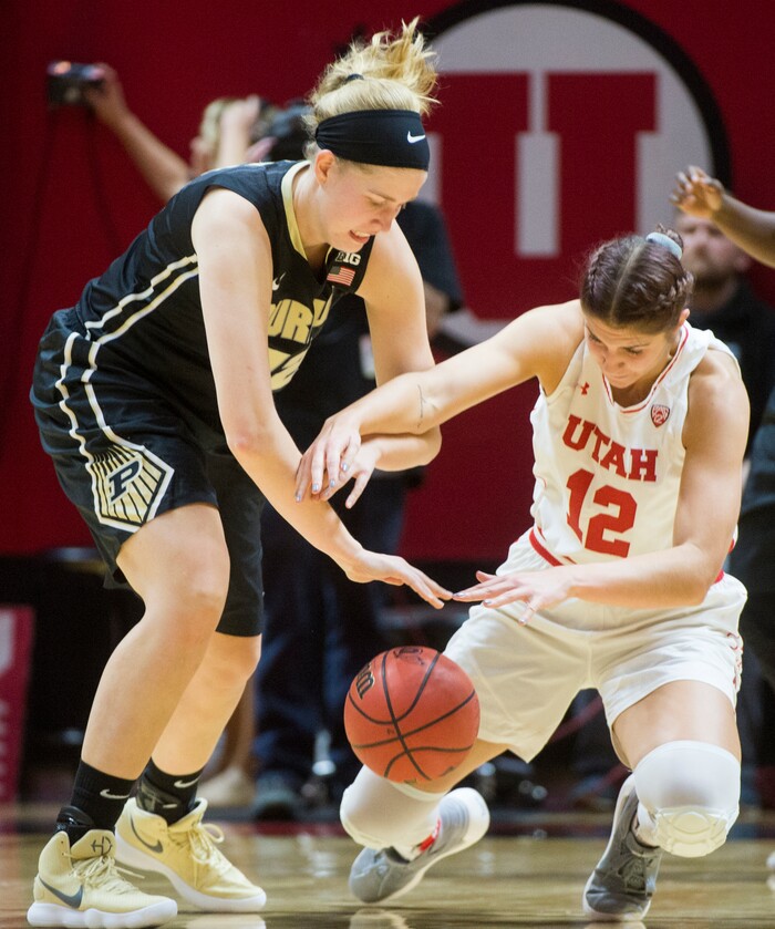 (Rick Egan  |  The Salt Lake Tribune)  Utah Utes forward Emily Potter (12) goes for the ball along with Purdue Boilermakers center Nora Kiesler (12), in basketball action Utah Utes vs. Purdue Boilermakers, at the Jon M. Huntsman Center, Monday, November 20, 2017.