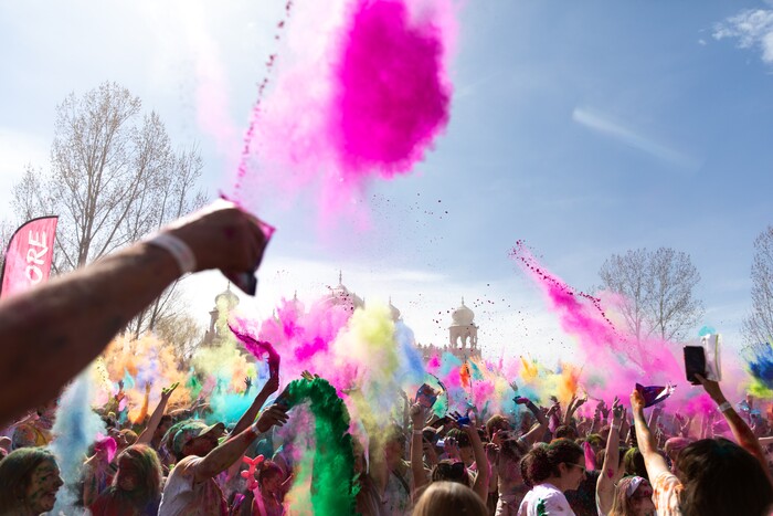 (Rachel Rydalch | The Salt Lake Tribune) Hundreds of people throw colors into the air during the Holi Color Festival at the Sri Sri Radha Krishna Temple in Spanish Fork on Saturday, March 26, 2022.
