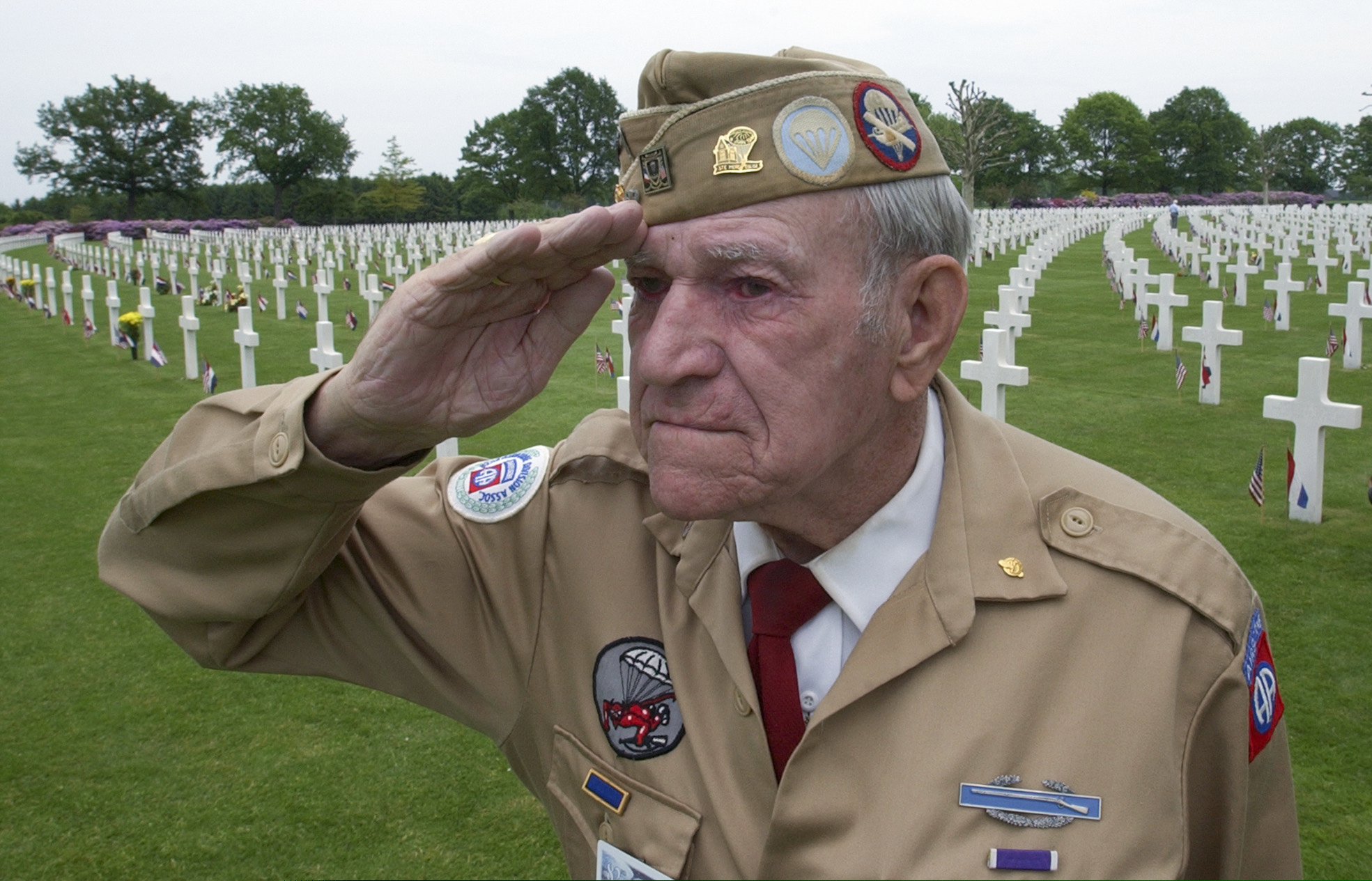 (Peter Dejong | AP photo)
In this, May 30, 2004, image, World War II veteran Harry Hudec of Cleveland, Ohio, salutes as the last post is played as he attends the 60-year commemoration service ahead of Memorial Day at the Netherlands American Cemetery in Margraten, southern Netherlands.