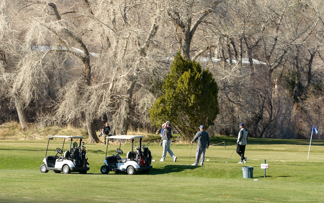(Leah Hogsten  |  The Salt Lake Tribune) Golfers tee off at El Monte in Ogden on Sunday, March 22, 2020. As the global battle against COVID-19 deepens, some Utahns have used the state's great outdoors as an alternative to isolating at home.