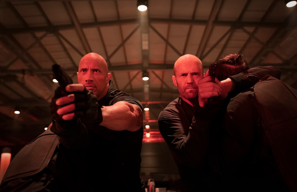(Photo courtesy of Universal Pictures) Luke Hobbs (Dwayne Johnson, left) and Deckard Shaw (Jason Statham) face a small army of gunmen in a scene from "Fast & Furious Presents: Hobbs & Shaw," directed by David Leitch.