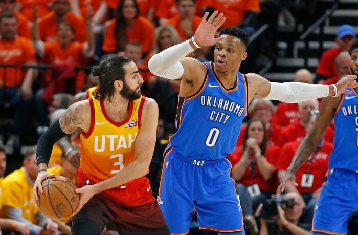 Oklahoma City Thunder guard Russell Westbrook (0) guards against Utah Jazz guard Ricky Rubio (3) in the first half during Game 3 of an NBA basketball first-round playoff series Saturday, April 21, 2018, in Salt Lake City. (AP Photo/Rick Bowmer)