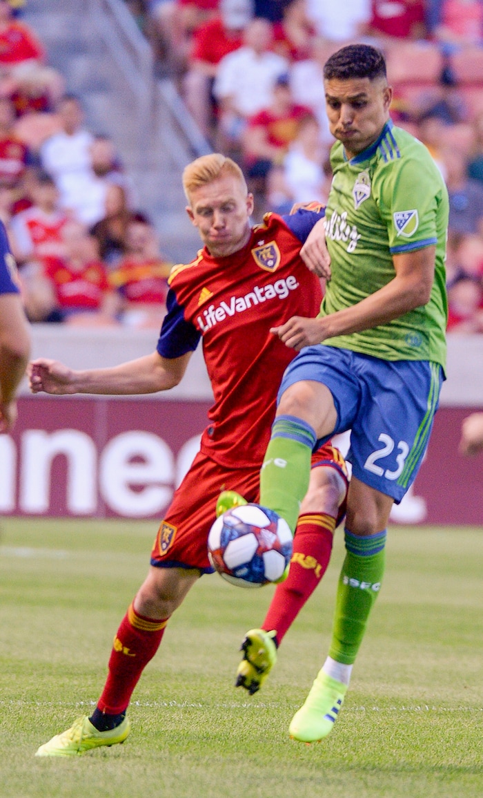 (Leah Hogsten  |  The Salt Lake Tribune) Real Salt Lake's Justin Glad battles Seattle Sounders midfielder Henry Wingo (23) as Real Salt Lake hosts the Seattle Sounders, Aug. 14, 2019, at Rio Tinto Stadium in Sandy.