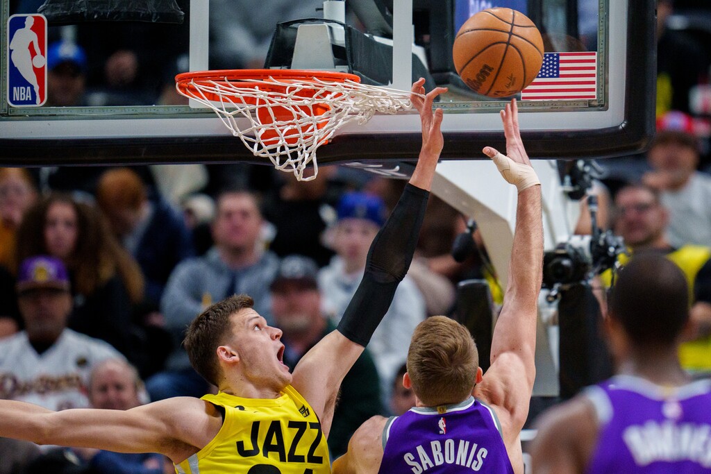 (Trent Nelson  |  The Salt Lake Tribune) Utah Jazz center Walker Kessler (24) defends a shot by Sacramento Kings forward Domantas Sabonis (10) as the Utah Jazz host the Sacramento Kings, NBA basketball in Salt Lake City on Monday, March 20, 2023.
